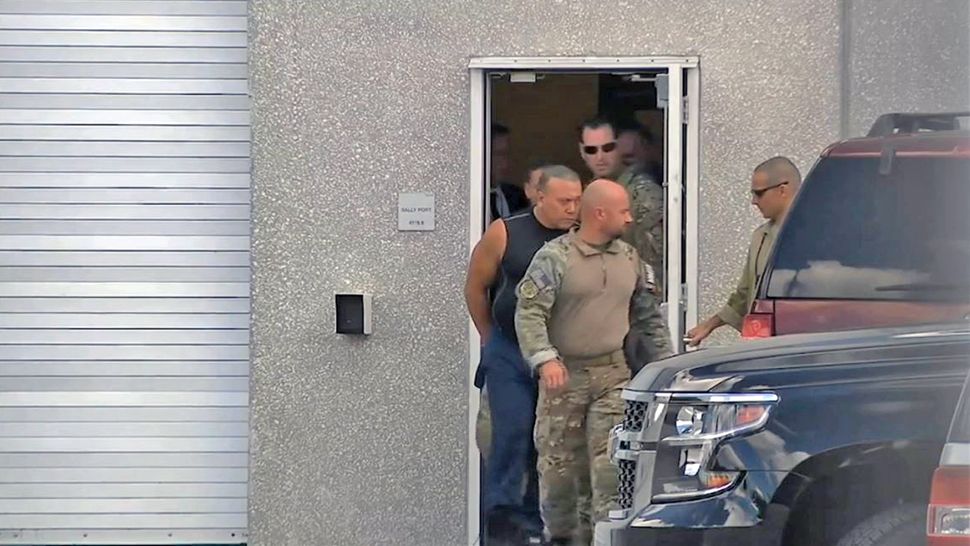 Cesar Sayoc is seen being lead away by federal agents on Friday, October 26, 2018. Sayoc is accused of mailing bombs to top Democrats and critics of President Donald Trump. (File photo by Associated Press)