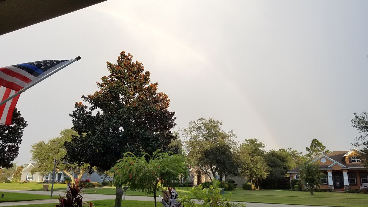 Sent via the Spectrum News 13 app: A double rainbow can just be seen as it rained and thundered on Monday, October 28, 2019. (Photo courtesy of Ruth Anderson, viewer)