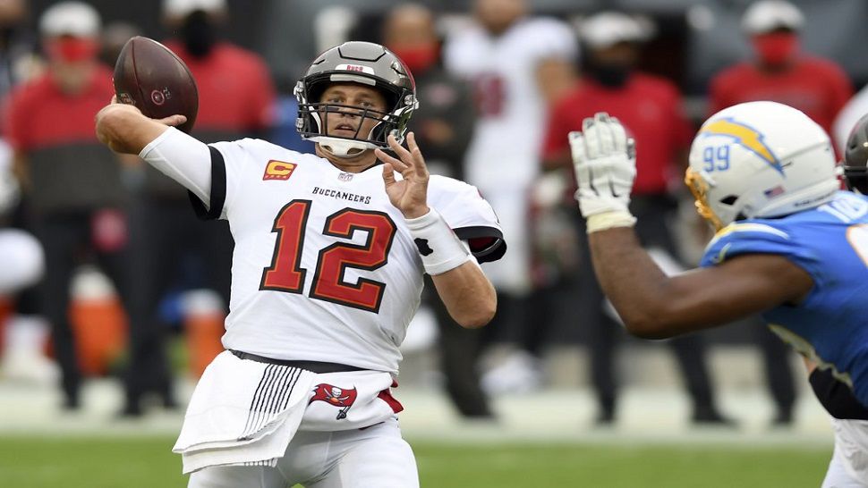 Tampa Bay Buccaneers quarterback Tom Brady tied a team record, throwing five touchdown passes (all to different receivers) in the Bucs' come-from-behind win over the Los Angeles Chargers. (AP Photo/Jason Behnken)