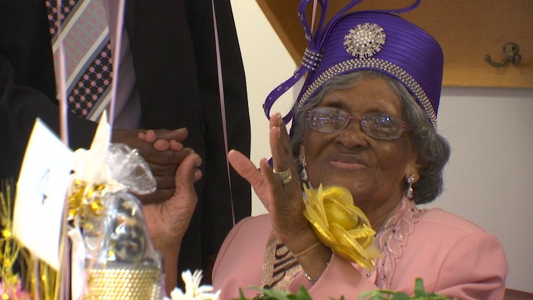 Gladys Burke celebrates at a party