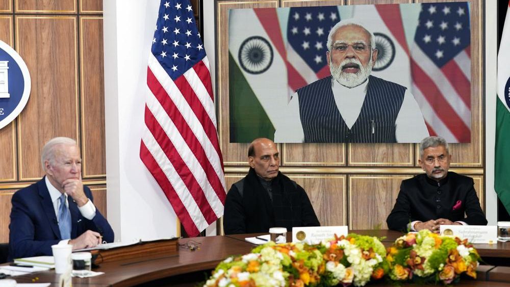 President Joe Biden meets virtually with Indian Prime Minister Narendra Modi in the South Court Auditorium on the White House campus in Washington, Monday, April 11, 2022. Indian Minister of Defense Rajnath Singh is center, Minister of External Affairs Subrahmanyam Jaishankar is right. (AP Photo/Carolyn Kaster)