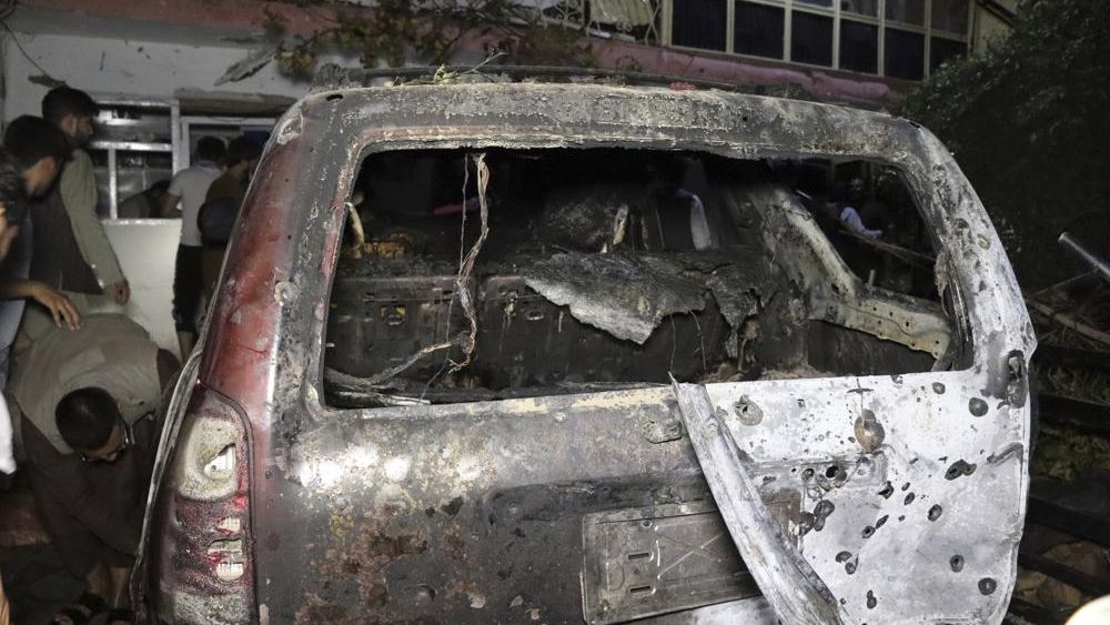 A destroyed vehicle is seen inside a house after a U.S. drone strike in Kabul, Afghanistan, Sunday, Aug. 29, 2021. (AP Photo/Khwaja Tawfiq Sediqi)