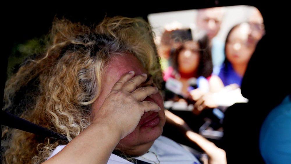 Grace Valencia, great aunt of shooting victim Uziyah Garcia, talks to the media from a vehicle after picking up a copy of the Texas House investigative committee report on the shootings at Robb Elementary School, Sunday, July 17, 2022, in Uvalde, Texas. (AP Photo/Eric Gay)