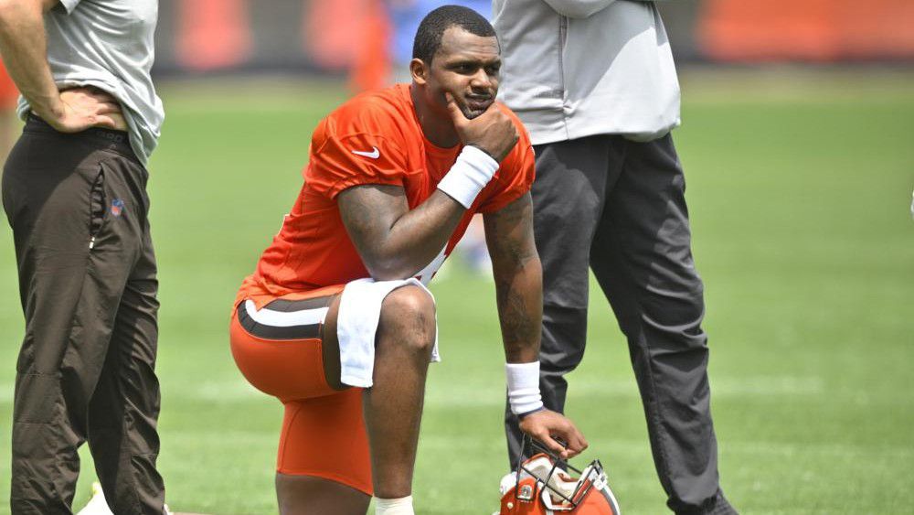 FILE - Cleveland Browns quarterback Deshaun Watson kneels on the field during an NFL football practice at the team's training facility on June 8, 2022, in Berea, Ohio. (AP Photo/David Richard, File)