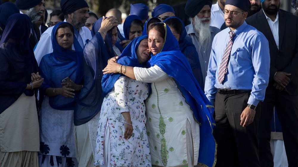 Mourners and family members of fallen Harris County Sheriff's Deputy Sandeep Dhaliwal get emotional as they arrive at Berry Center for his funeral services on Wednesday, Oct. 2, 2019, in Cypress. Dhaliwal, a trailblazer and 10-year veteran of the agency, was killed in an ambush during a traffic stop last Friday. (Yi-Chin Lee/Houston Chronicle via AP)