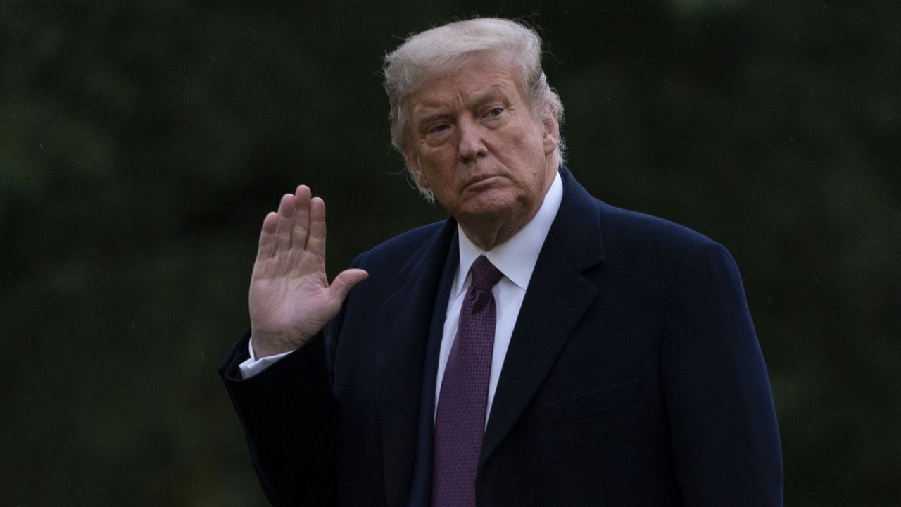 President Donald Trump waves as he walks from Marine One to the White House in Washington, Thursday, Oct. 1, 2020, as he returns from Bedminster, N.J. (AP Photo/Carolyn Kaster)