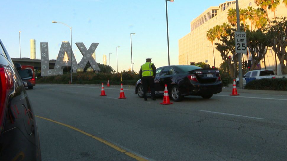 The Los Angeles International Airport is ending curbside picking for ridesharing or taxi drivers. (Spectrum News)