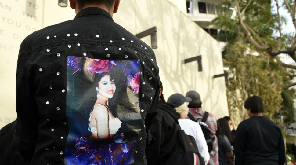 An image of a person wearing a jacket with an image of Selena on the back (AP Image/File)