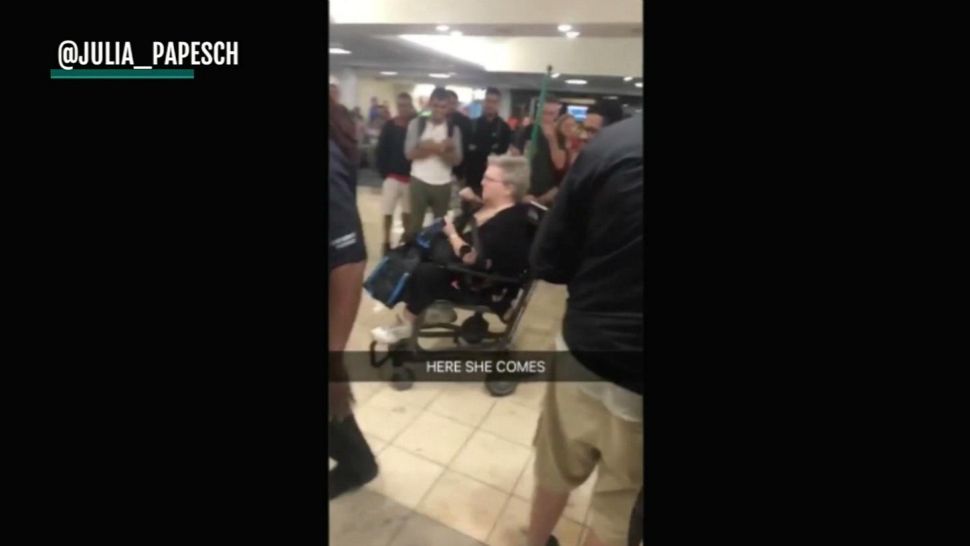 Passengers on a Frontier flight Tuesday night at Orlando International Airport took to social media after they were asked to get off the plane. A woman said she had an "emotional support squirrel," which the airline doesn't permit. (@julia_papesch via CNN video)