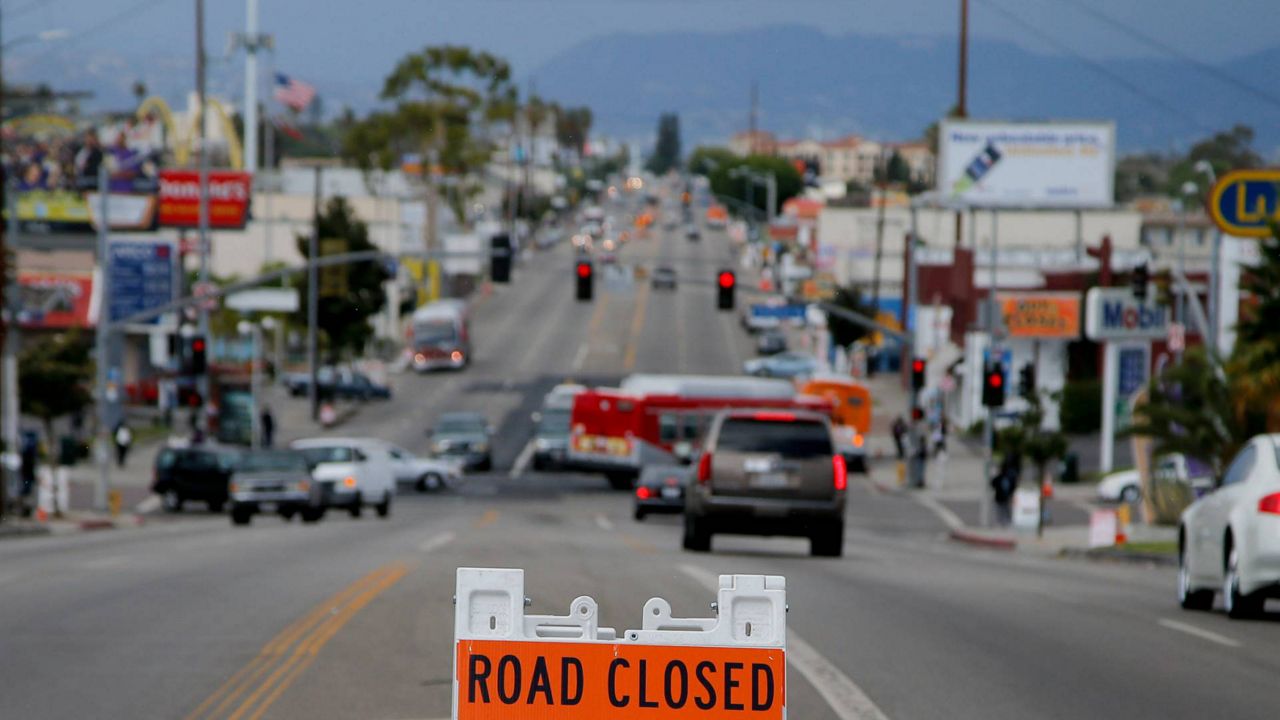 A sign advising the street closure is seen on Crenshaw Boulevard in Inglewood, Calif., Oct. 11, 2012. (AP Photo/Jae C. Hong)