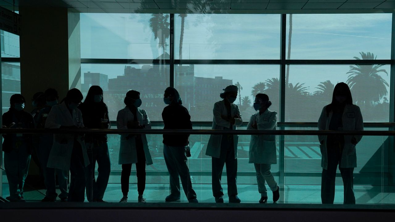 Medical staff at Kaiser Permanente Los Angeles Medical Center on Dec. 14, 2020. (AP Photo/Jae C. Hong)