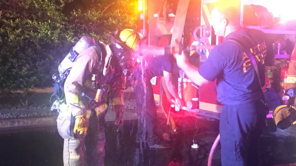Firefighters deconned after South Austin house fire. (Courtesy: @AustinFireInfo)