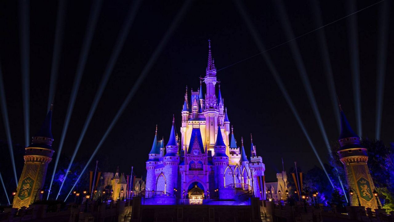 Cinderella Castle lit in purple and gold to celebrate the NBA Champion Los Angeles Lakers. (Courtesy of Disney Parks)