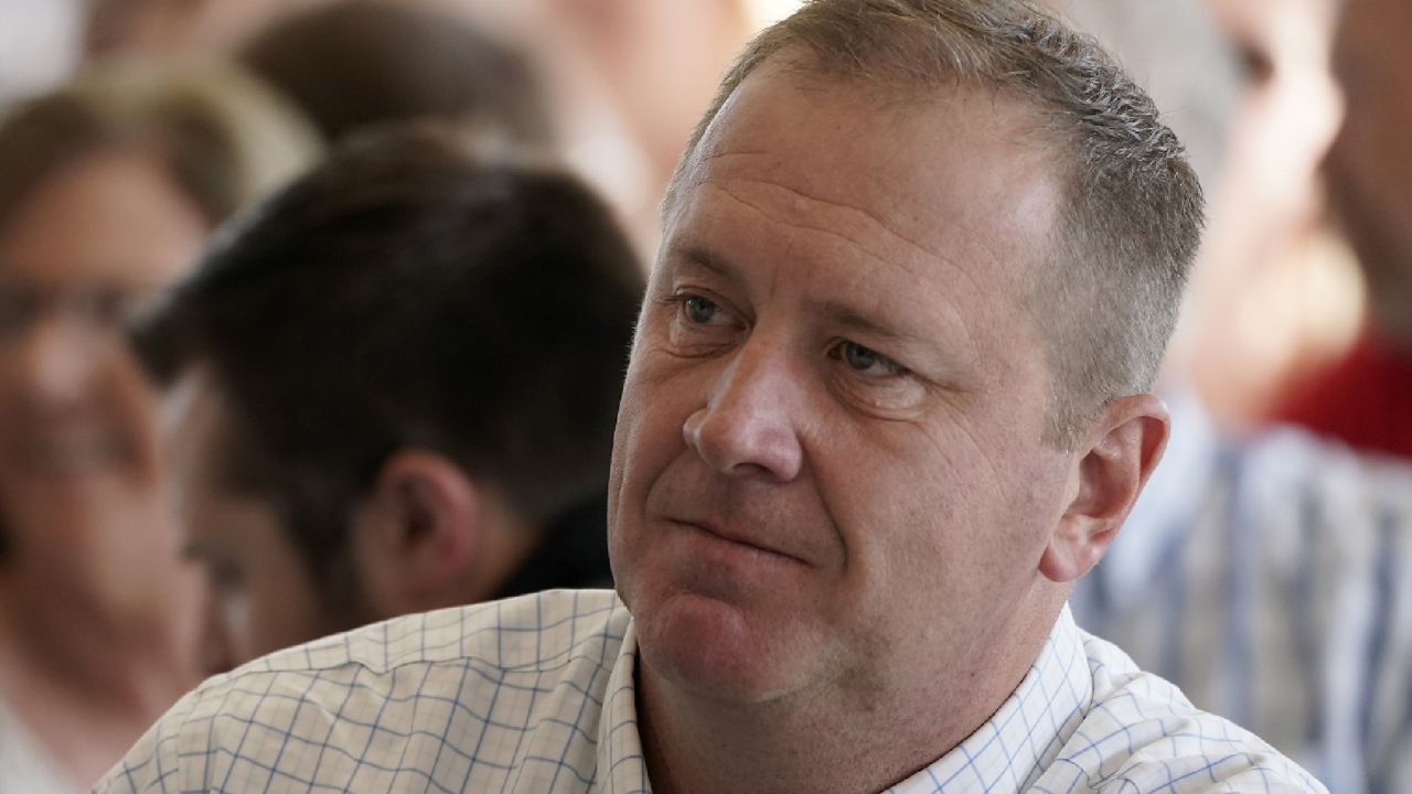 Republican U.S. Senate candidate and Missouri Attorney General Eric Schmitt listens to a speaker at the Governor's Ham Breakfast at the Missouri State Fair in Sedalia, Mo. Thursday, Aug. 18, 2022. (AP Photo/Charlie Riedel)