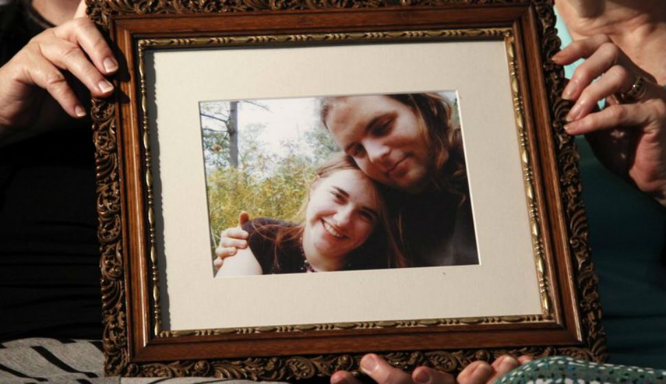 In this June 4, 2014, file photo, mother’s Linda Boyle, left and Lyn Coleman hold photo of their married children, Canadian citizen Joshua Boyle and American citizen Caitlan Coleman, who were kidnapped by the Taliban in late 2012, in Stewartstown, Pa. Pakistan’s military says soldiers have recovered five Western hostages held by the Taliban for years. Pakistan’s army did not name those held, only saying it worked with U.S. intelligence officials to track down the hostages and free them after discovering they had been brought into Pakistan.