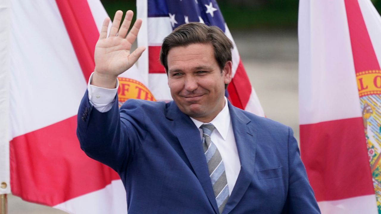 In this file photo from Tuesday, September 8, 2020, Florida Gov. Ron DeSantis attends an event with President Donald Trump on the environment at the Jupiter Inlet Lighthouse and Museum in Jupiter, Florida. (John Raoux/AP)