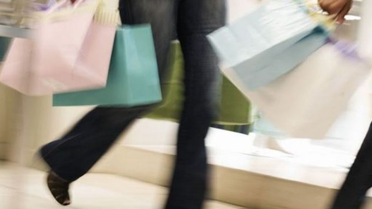 Mall shopper with bags in hand