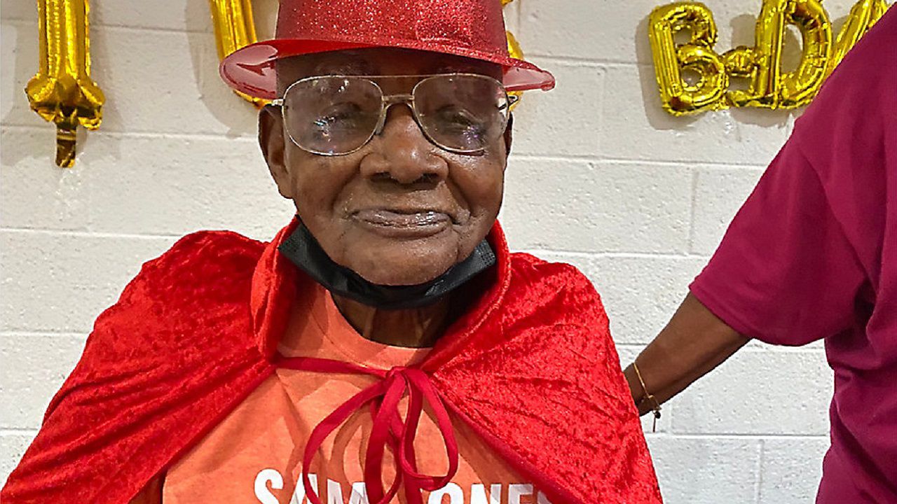 Sam Jones smiles as he celebrates his 105th birthday.