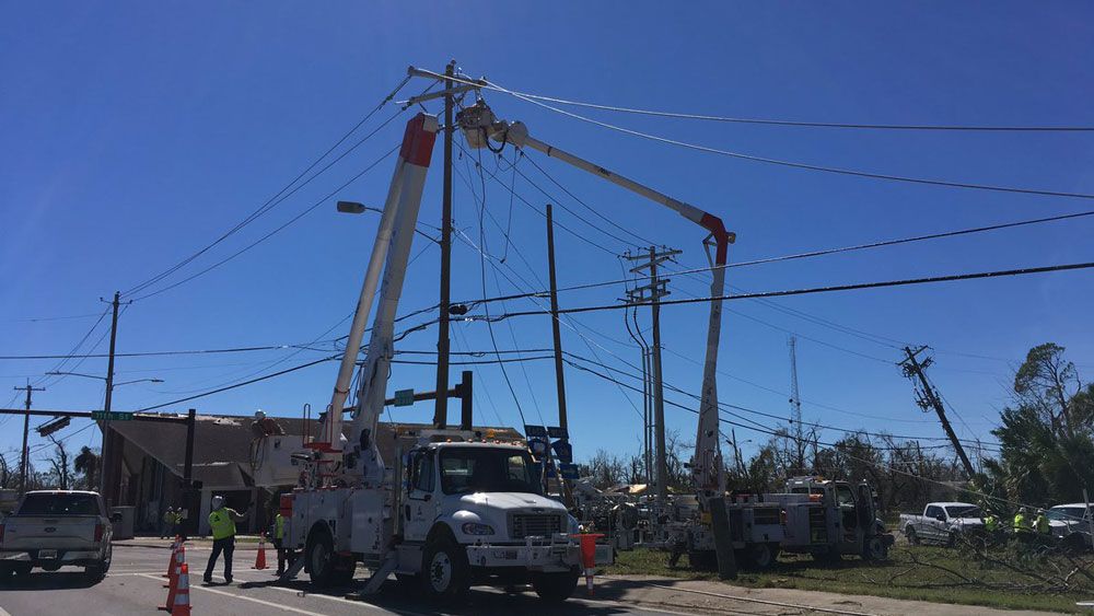 Electric poles are restored in Panama City. 