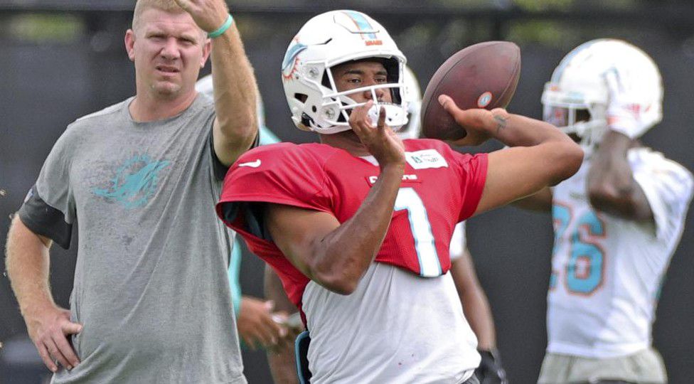 Miami Dolphins quarterbacks coach Charlie Frye works with Dolphins quarterback Tua Tagovailoa (1) during practice at Baptist Health Training Complex in Hard Rock Stadium on Wednesday, October 13, 2021 in Miami Gardens, Florida, in preparation for their game against the Jacksonville Jaguars at Tottenham Hotspur Stadium in London on Sunday, October 17.(David Santiago/Miami Herald via AP)