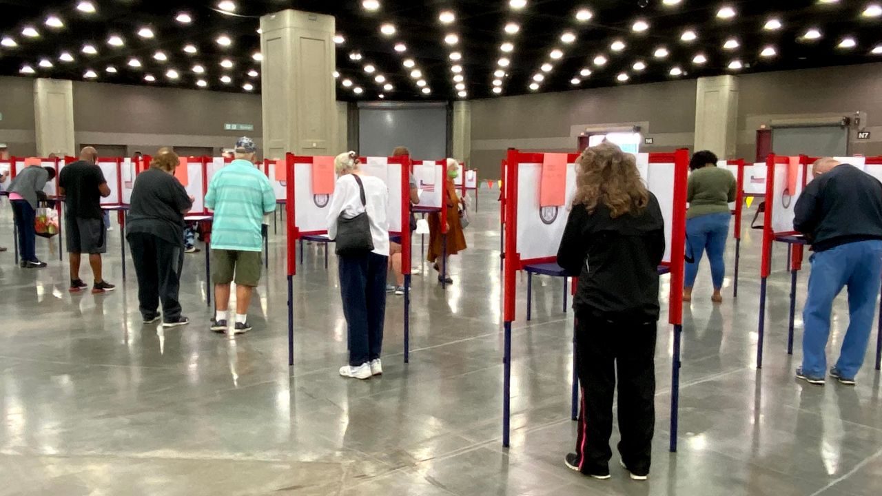 voters casting their ballot in louisville kentucky