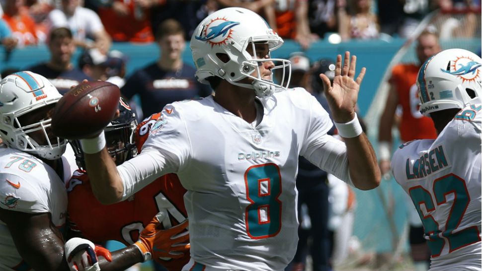 Miami Dolphins quarterback Brock Osweiler (8) looks to pass, during the first half of an NFL football game against the Chicago Bears, Sunday, Oct. 14, 2018, in Miami Gardens, Fla. (AP Photo/Joel Auerbach)