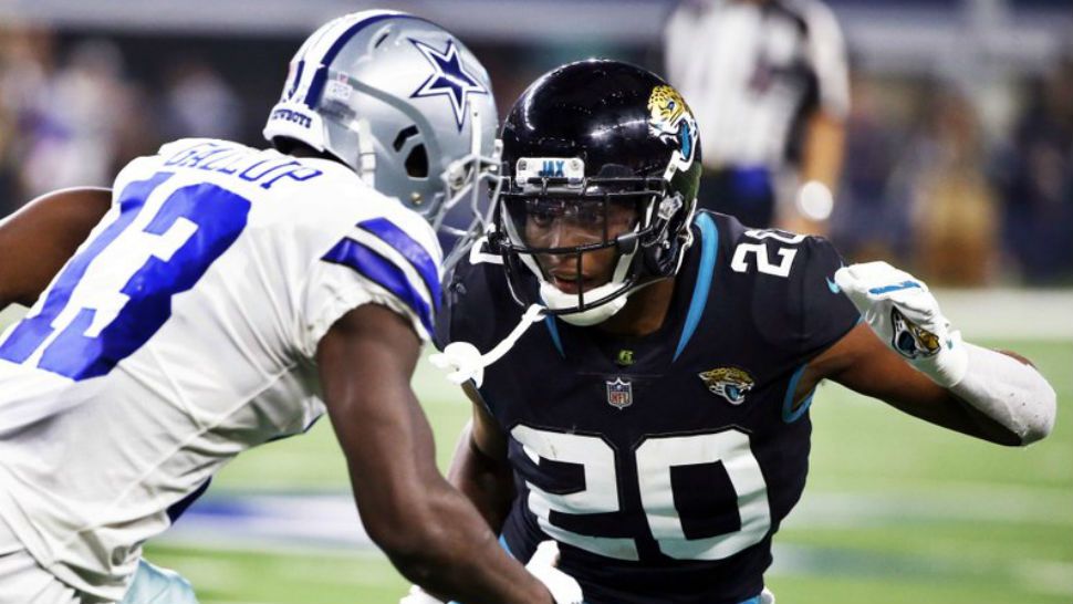 FILE - In this Sunday, Oct. 14, 2018, file photo, Jacksonville Jaguars cornerback Jalen Ramsey (20) defends against Dallas Cowboys wide receiver Michael Gallup (13) during the second half of an NFL football game in Arlington, Texas. The NFL's loudest trash talker is at a loss for words. Ramsey had little to say during his weekly media session. It was a repeat performance from his post-game news conference that followed a 40-7 loss to Dallas. (AP Photo/Ron Jenkins, File)