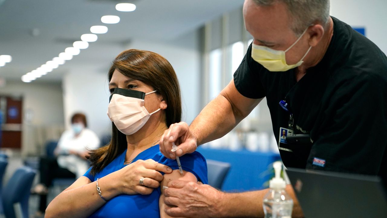 A person receives a COVID-19 vaccine injection in this file image. (AP)