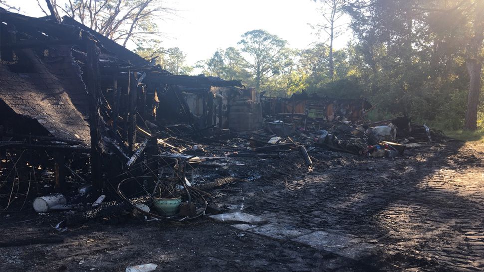 The fire started in a shed in the backyard of the home on Sonny Drive in Wesley Chapel. The flames then spread to the house and also destroyed the family's vehicles. (Jorja Roman/Spectrum News)