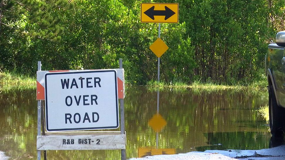 Residents near a canal in Merritt Island are concerned over a flooded road, and they say it’s getting worse and worse. (Krystel Knowles/Spectrum News 13)