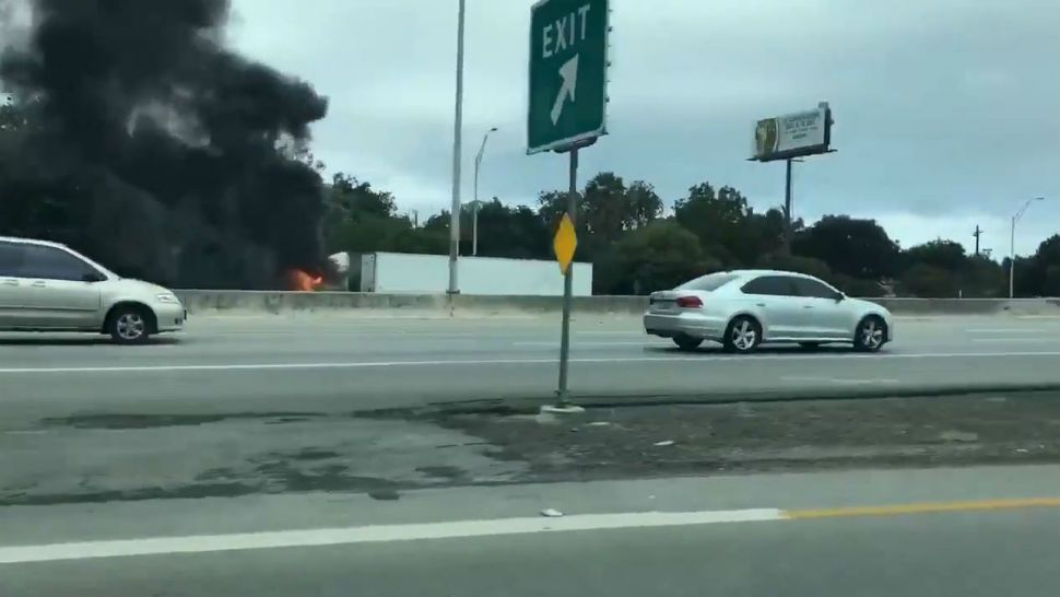 Tractor-trailer catches on fire on 281 in San Antonio. (Spectrum News Photo)