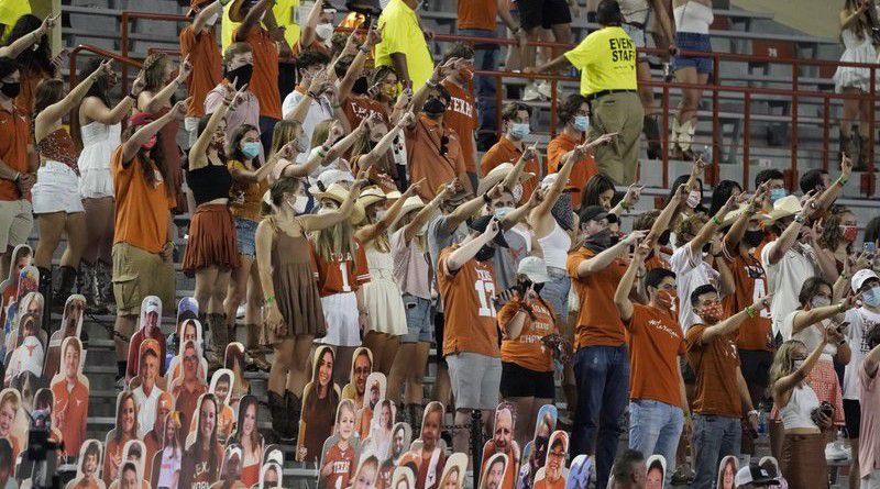 In this Saturday, Sept. 12, 2020, file photo, fans join in singing "The Eyes of Texas" after Texas defeated UTEP 59-3 in an NCAA college football game in Austin, Texas. (AP Photo/Chuck Burton, File)