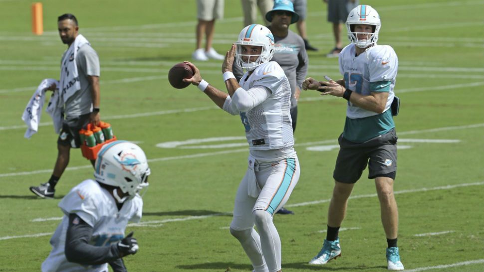 Miami Dolphins quarterbacks Ryan Tannehill #17 and Miami Dolphins quarterback Brock Osweiler #8 running drills during practice at the Baptist Health Training Facility at Nova Southeastern University in Davie on Wednesday, October 17, 2018, in preparation for their game against the Detroit Lions on Sunday at Hard Rock Stadium in Miami Gardens.(David Santiago/Miami Herald via AP)