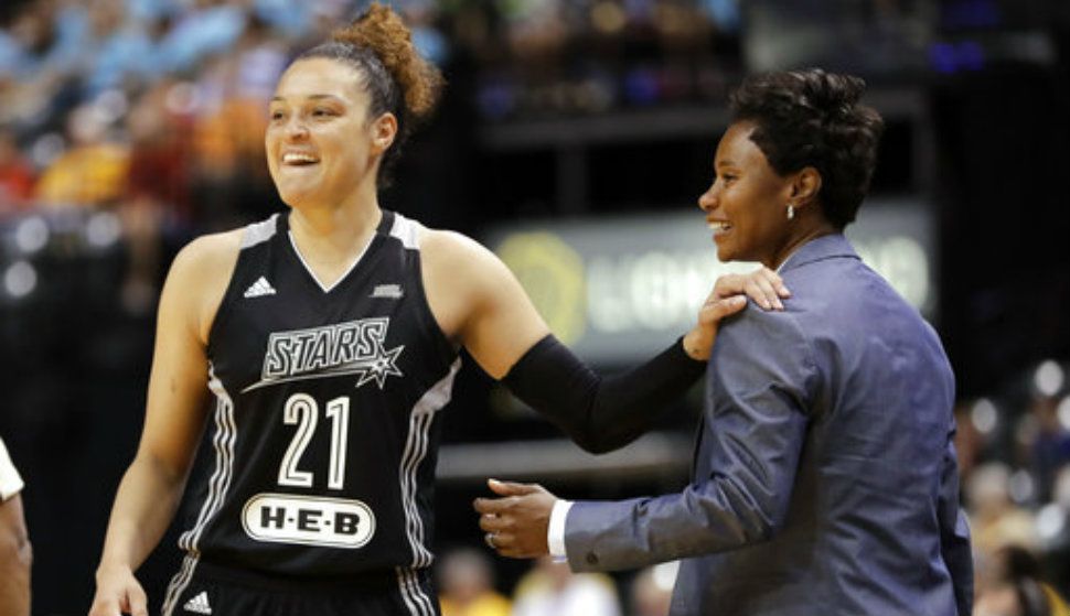In this July 12, 2017, file photo, San Antonio Stars' Kayla McBride laughs with head coach Vickie Johnson during the second half of a WNBA basketball game against the Indiana Fever, in Indianapolis. 