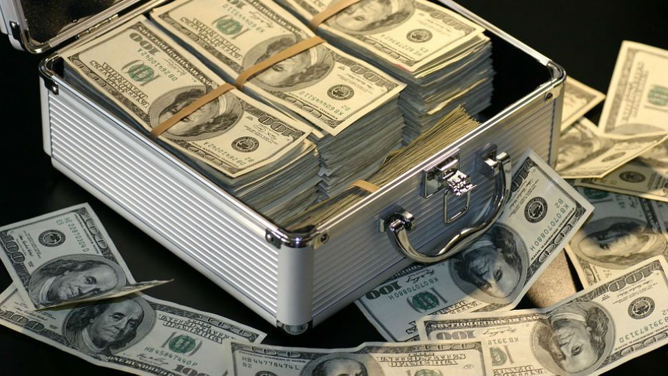FILE photo of a briefcase full of cash. (Pixabay)