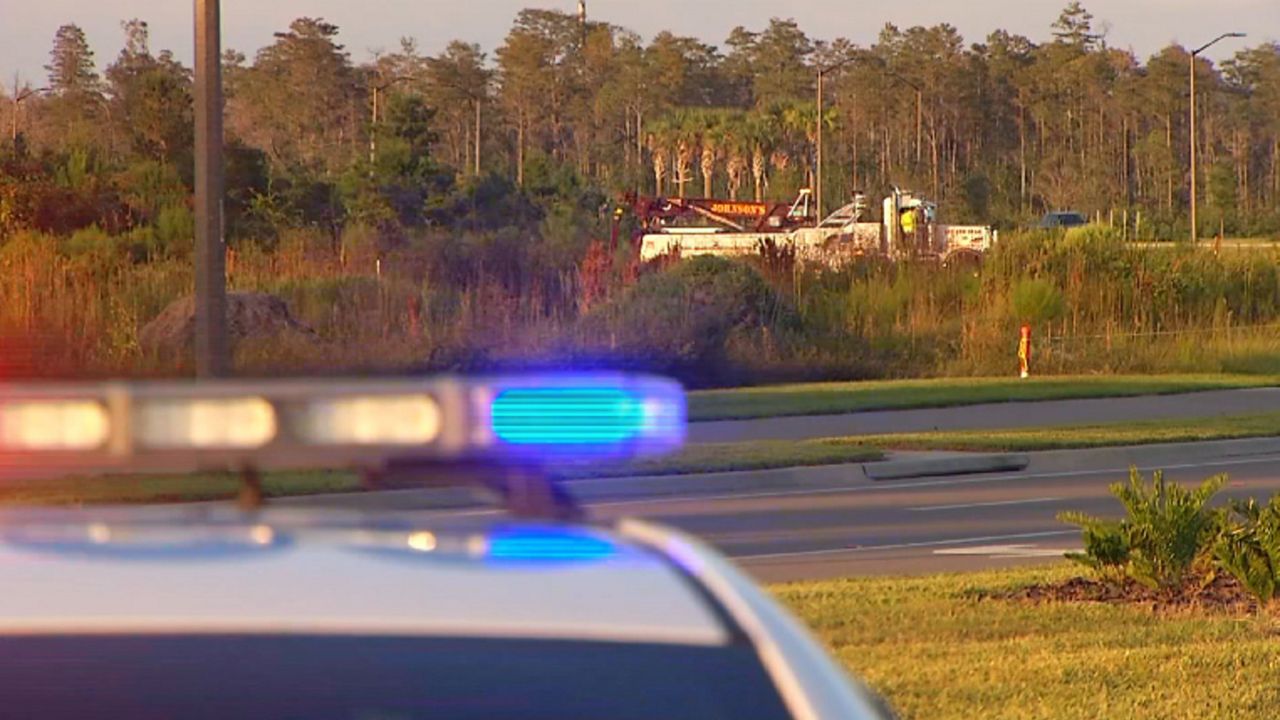 A vehicle with a body inside was found submerged in an Orlando retention pond Saturday. (Spectrum News 13)