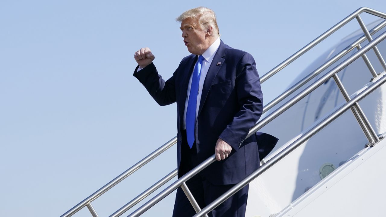President Donald Trump steps off Air Force One at John Wayne Airport, Sunday, Oct. 18, 2020, in Santa Ana, Calif. (AP Photo/Alex Brandon)