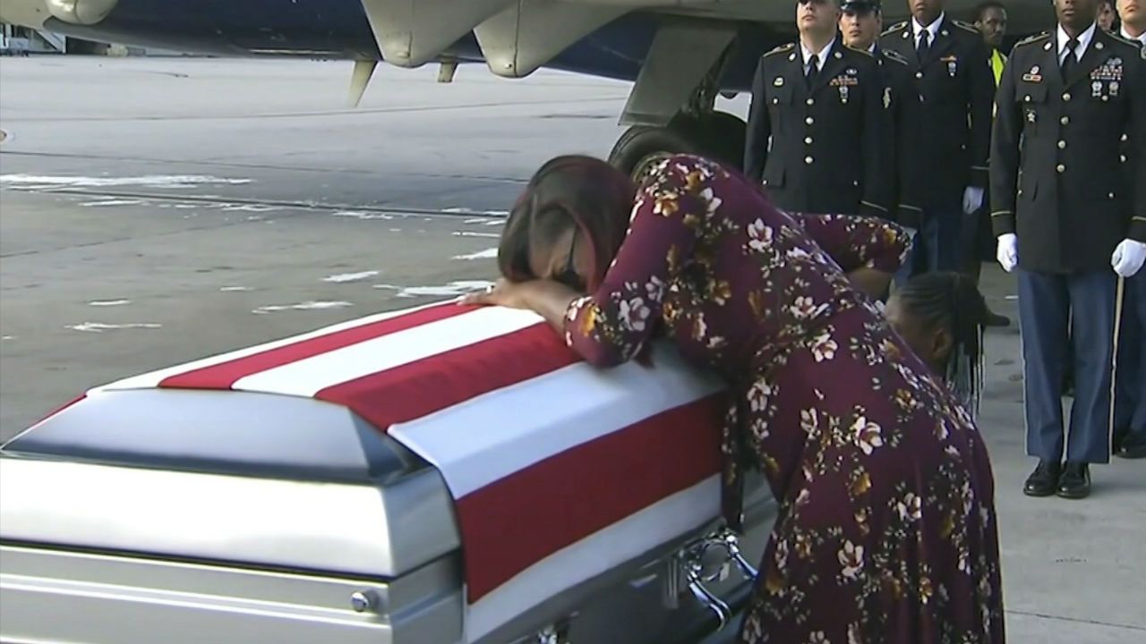 Myeshia Johnson cries over the casket of her husband, Sgt. La David Johnson