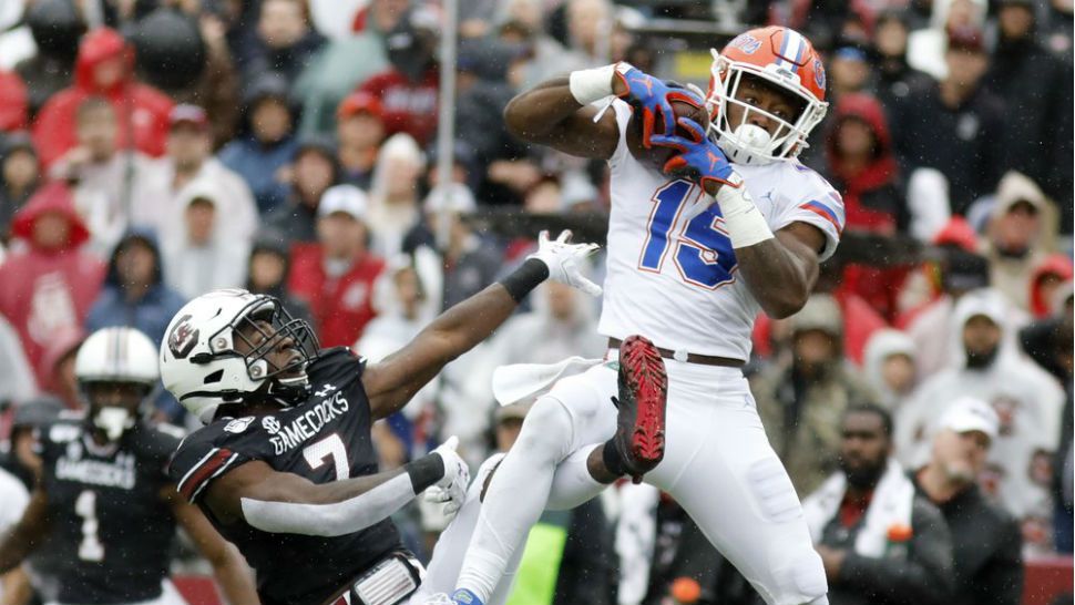 Florida's Jacob Copeland catches a pass for a touchdown as South Carolina's Jammie Robinson defends in the first half of an NCAA college football game Saturday, in Columbia, South Carolina. (AP Photo/Mic Smith)