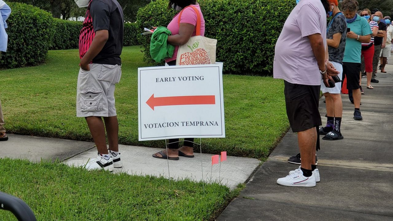 Lines for early voting stretched around buildings and down roads throughout Central Florida Monday, including at this location at South Creek Library in Orange County. (Cheryn Stone, Spectrum News)