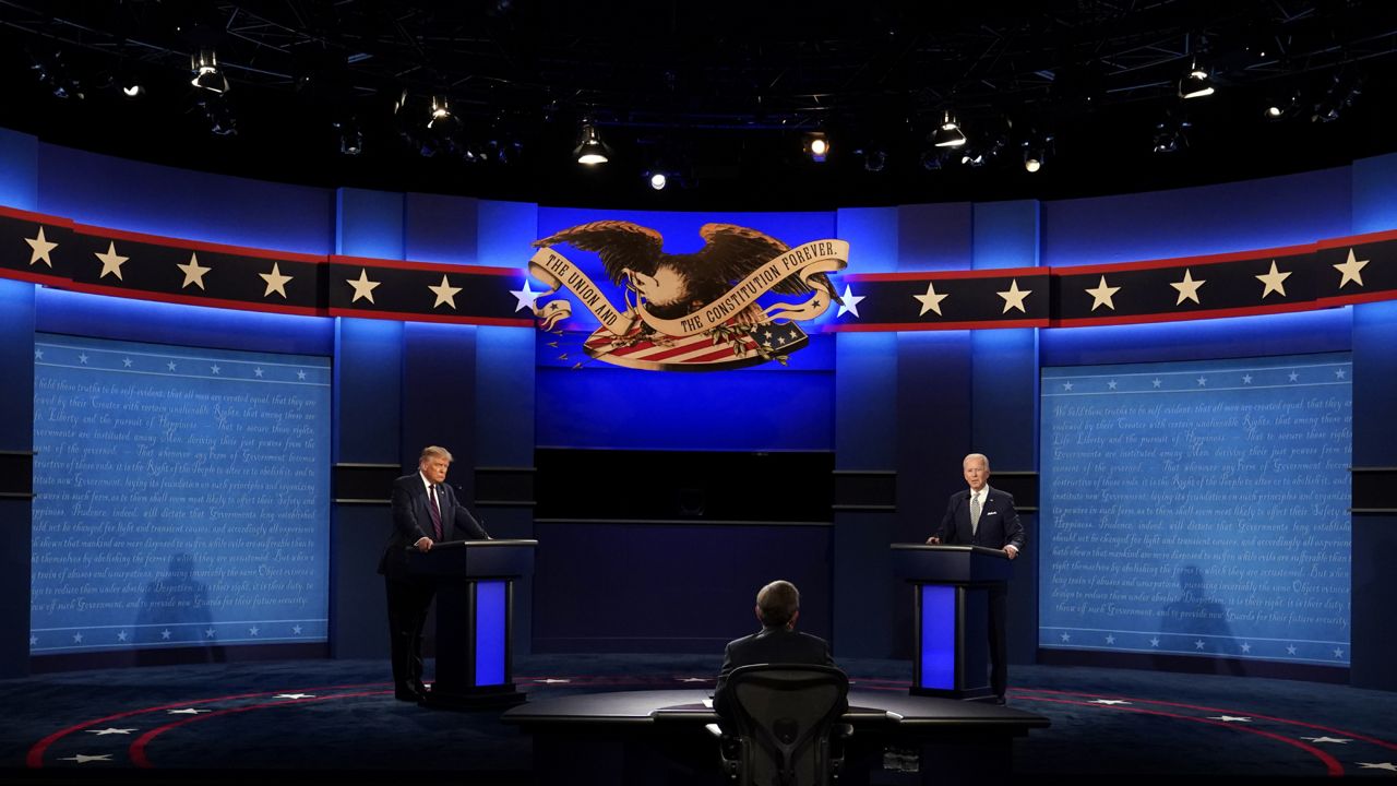 Moderator Chris Wallace of Fox News listens as President Donald Trump and Democratic candidate former Vice President Joe Biden participate in the first presidential debate Tuesday, Sept. 29, 2020, at Case Western University and Cleveland Clinic, in Cleveland, Ohio. (AP Photo/Patrick Semansky)