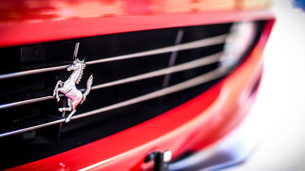 Closeup photo of the Ferrari emblem. 