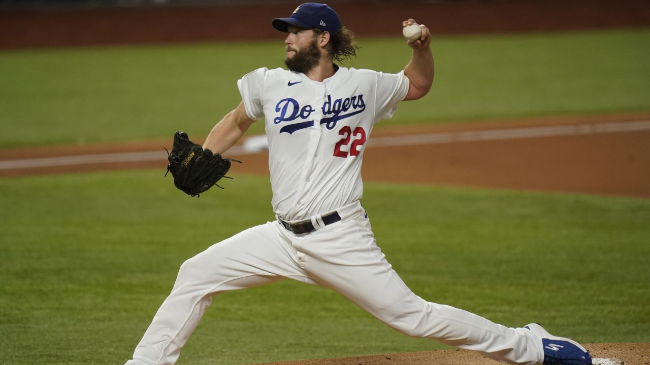 Los Angeles Dodgers starting pitcher Clayton Kershaw throws against the Tampa Bay Rays during the first inning in Game 1 of the baseball World Series Tuesday, Oct. 20, 2020, in Arlington, Texas. (AP Photo/Eric Gay)