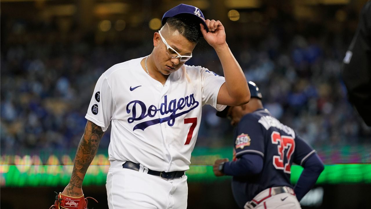 Los Angeles Dodgers pitcher Julio Urías walks off the mound after the third inning against the Atlanta Braves in Game 4 of baseball's National League Championship Series Wednesday, Oct. 20, 2021, in Los Angeles. (AP Photo/Jae Hong)