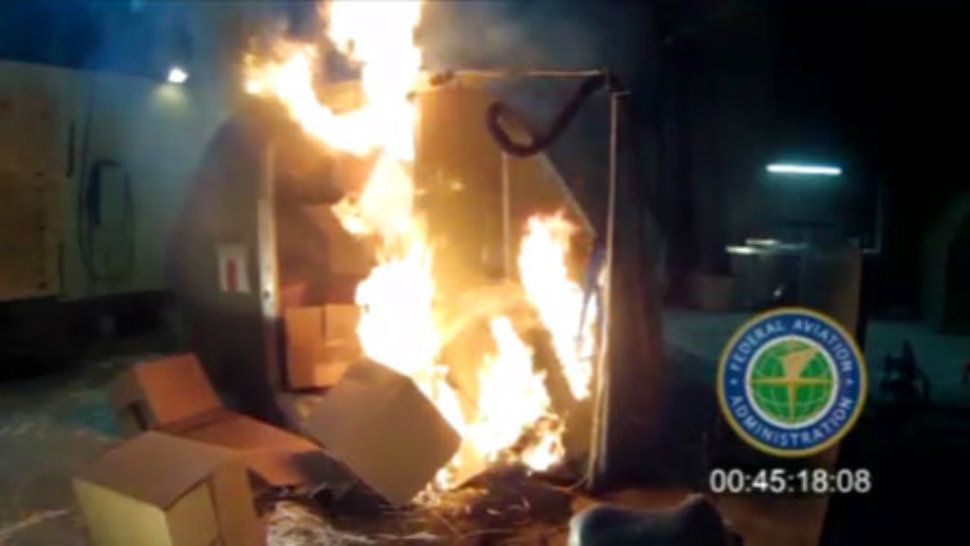 In this April 2014 file image frame grab from video, provided by the Federal Aviation Administration (FAA), a test at the FAAs technical center in Atlantic City, N.J. The U.S. government is urging that large, personal electronic devices like laptops be banned from airline checked luggage because of the potential for a catastrophic fire. (FAA via AP, File)