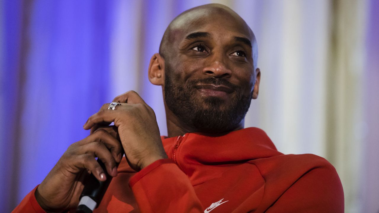 Former Los Angeles Lakers NBA basketball player Kobe Bryant listens to a question as he meets with students at Andrew Hamilton School in Philadelphia, Thursday, March 21, 2019.
