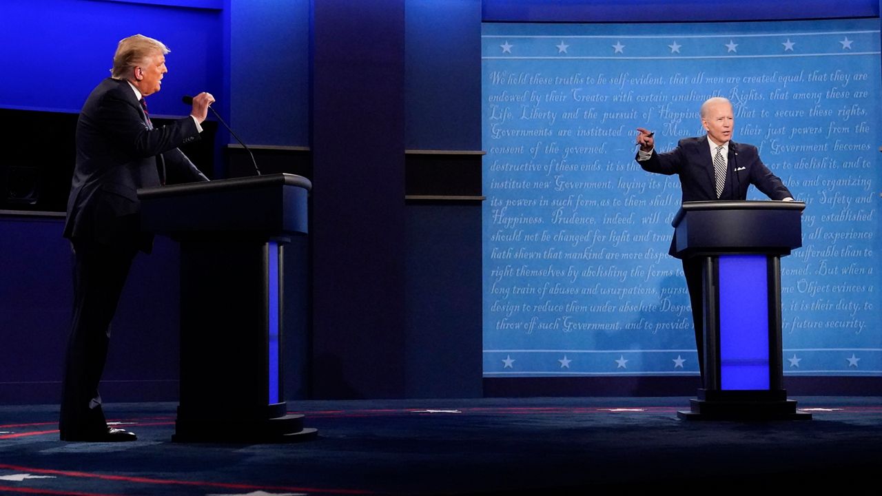 President Donald Trump, left, and Democratic presidential candidate former Vice President Joe Biden, right, gesturing during the first presidential debate Tuesday, Sept. 29, 2020, at Case Western University and Cleveland Clinic, in Cleveland, Ohio. (AP Photo/Julio Cortez)