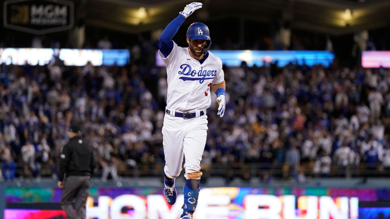 Los Angeles Dodgers' Chris Taylor celebrates after hitting a solo home run in the seventh inning against the Atlanta Braves in Game 5 of baseball's National League Championship Series Thursday, Oct. 21, 2021, in Los Angeles. (AP Photo/Jae C. Hong)