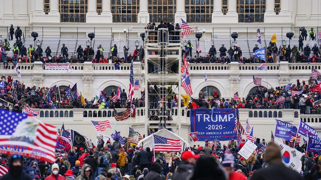 Insurrectionists loyal to President Donald Trump breach the Capitol in Washington, Jan. 6, 2021. (AP Photo/John Minchillo)