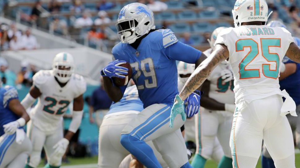 FILE - In this Oct. 21, 2018, file photo, Detroit Lions running back LeGarrette Blount (29) runs for a touchdown during the first half of an NFL football game against the Miami Dolphins, in Miami Gardens, Fla. The Dolphins need to patch up their leaky run defense, and fast. After allowing 248 yards rushing last week in a loss to Detroit, the Dolphins must regroup to face Houston on Thursday. (AP Photo/Lynne Sladky, File)